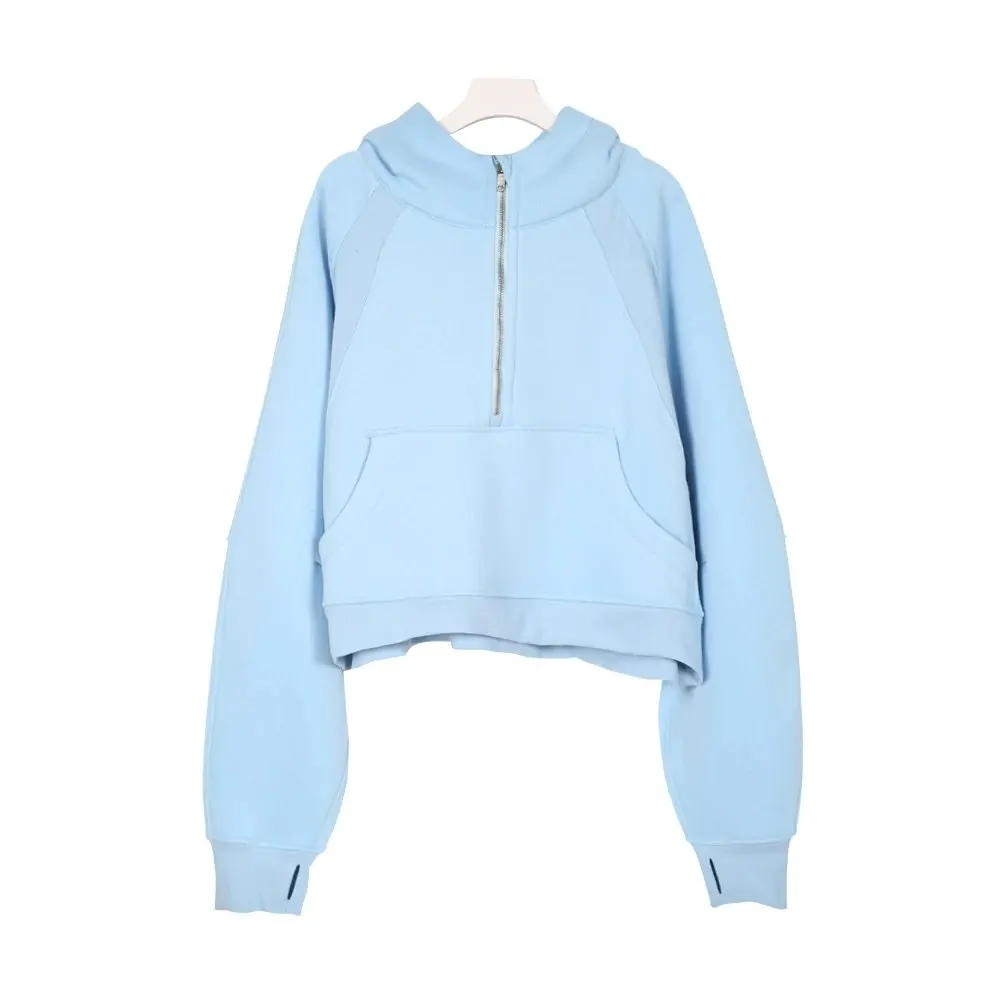 Pale blue half-zip hoodie isolated on a hanger on a verified product page